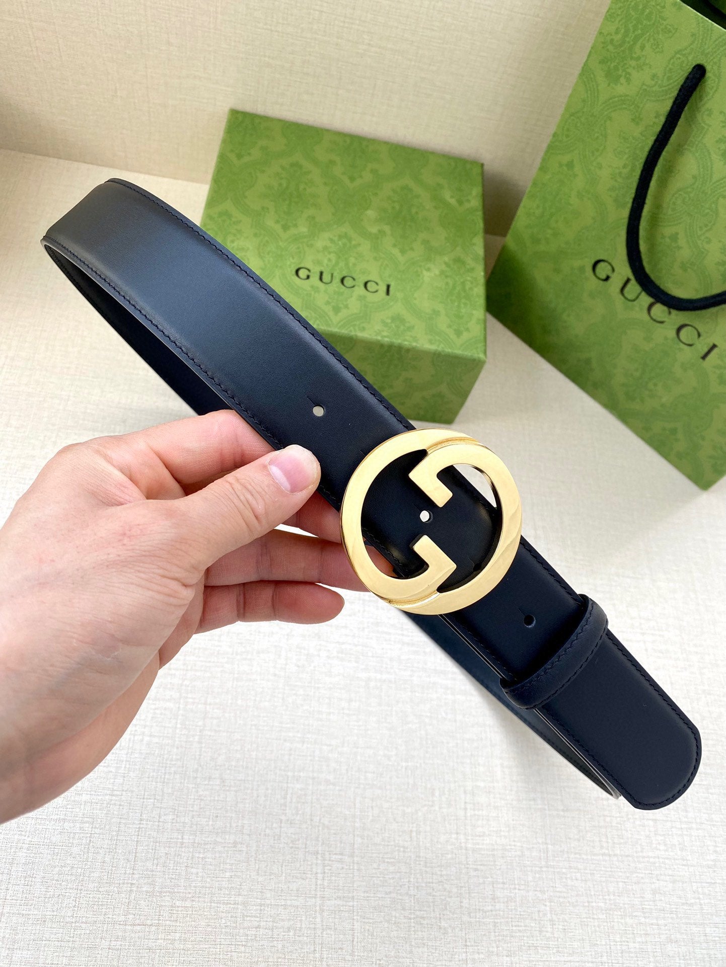 Gucci leather belt in dark blue with gold-tone interlocking G buckle