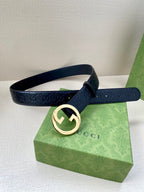 Gucci navy leather belt with embossed GG texture and gold-tone double G buckle