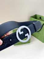 Gucci navy leather belt with embossed GG texture and silver-tone double G buckle