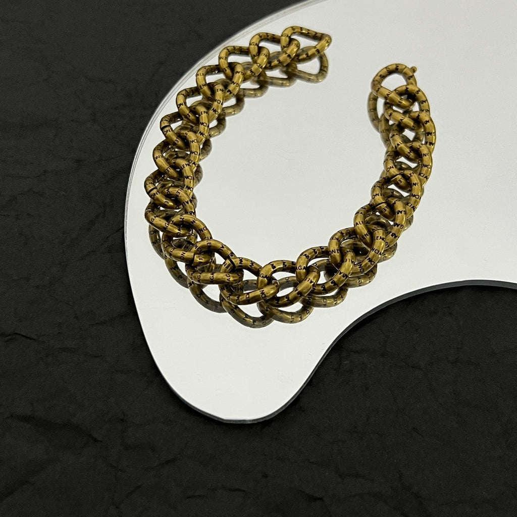 Balenciaga gold-tone chunky chain bracelet with curved links and BALENCIAGA logo