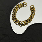 Balenciaga gold-tone chunky chain bracelet with curved links and BALENCIAGA logo