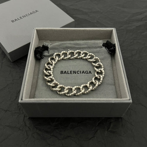 Balenciaga chain bracelet with silver-tone links and black fabric ends in gift box