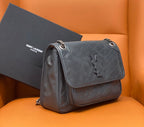 Saint Laurent crossbody bag with quilted leather, top flap, and chain shoulder strap