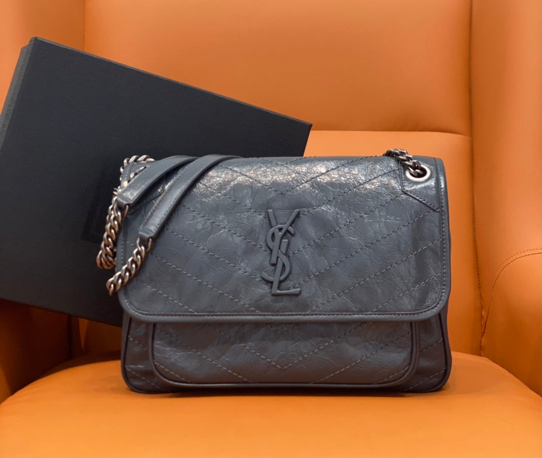 Saint Laurent crossbody bag in dark blue leather with YSL logo and chain strap