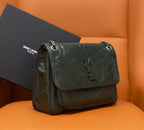 Dark green leather shoulder bag with flap, chain strap, and snap closure