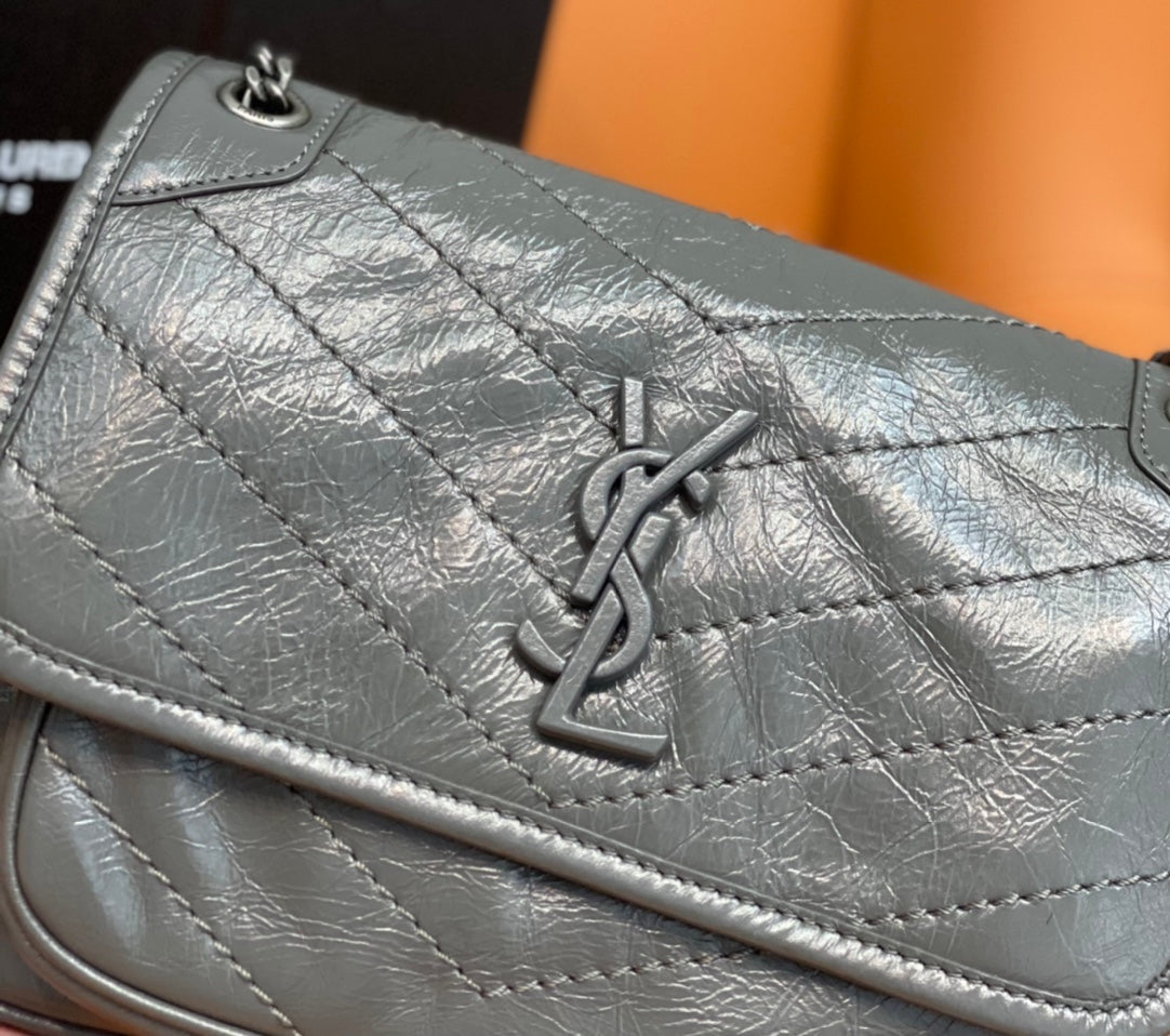 Quilted leather flap with YSL monogram and metal clasp, light gray