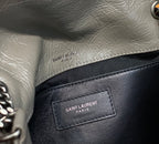 Saint Laurent Paris label inside pocket on metallic gray and black shoulder bag
