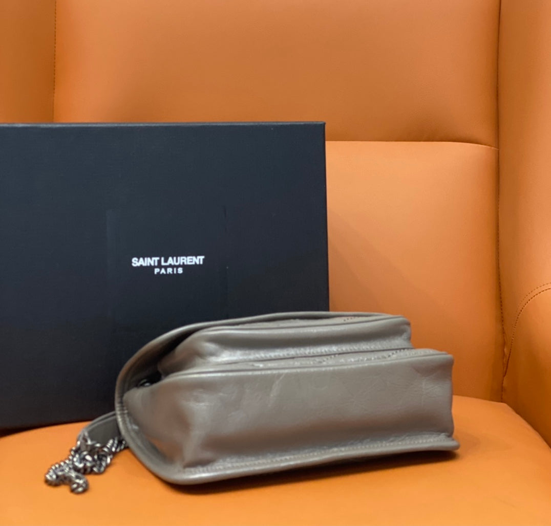 Saint Laurent shoulder bag with flap and chain strap, shown from the back