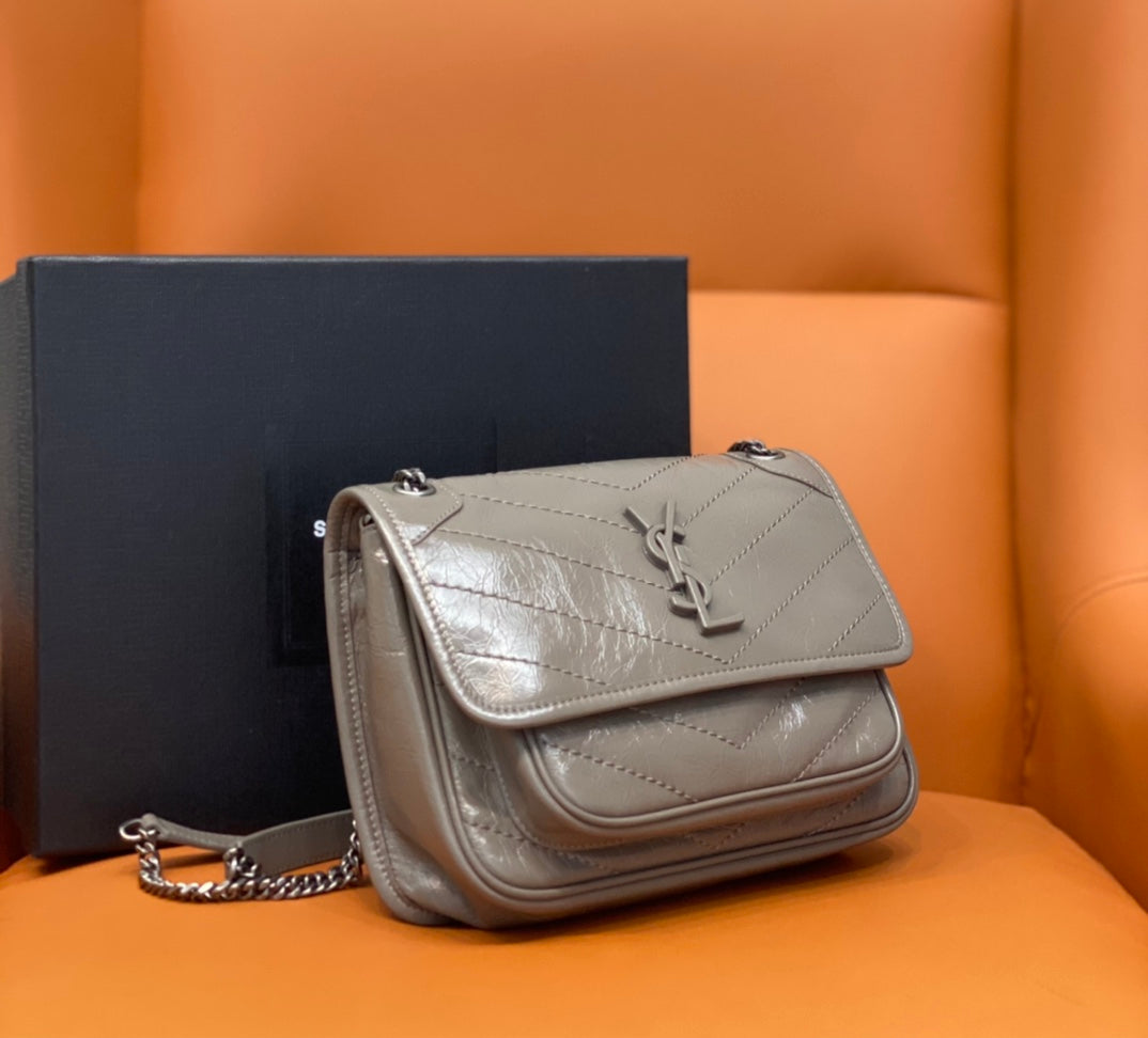 Small Saint Laurent shoulder bag in light metallic gray with flap and chain strap