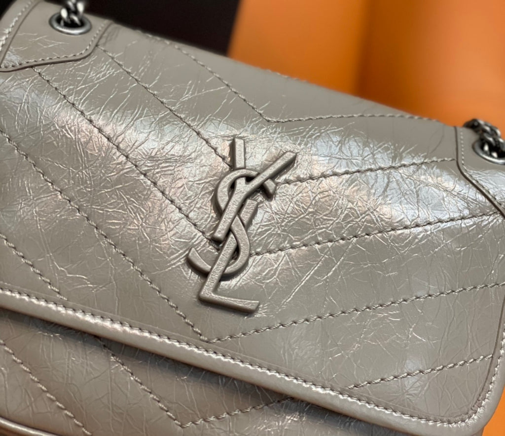 Saint Laurent YSL monogram on metallic gray quilted flap of shoulder bag