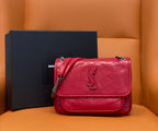 Red quilted shoulder bag with chain strap and front flap