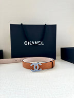 Brown leather belt with silver-and-blue logo buckle and smooth strap edge