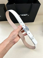 Chanel belt held up: white strap with blue crystal CC buckle and perforated holes
