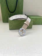 Beige leather belt with silver-tone GG buckle and light monogram strap section