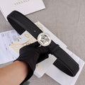 Versace belt, black leather strap with silver medallion buckle and long keeper.