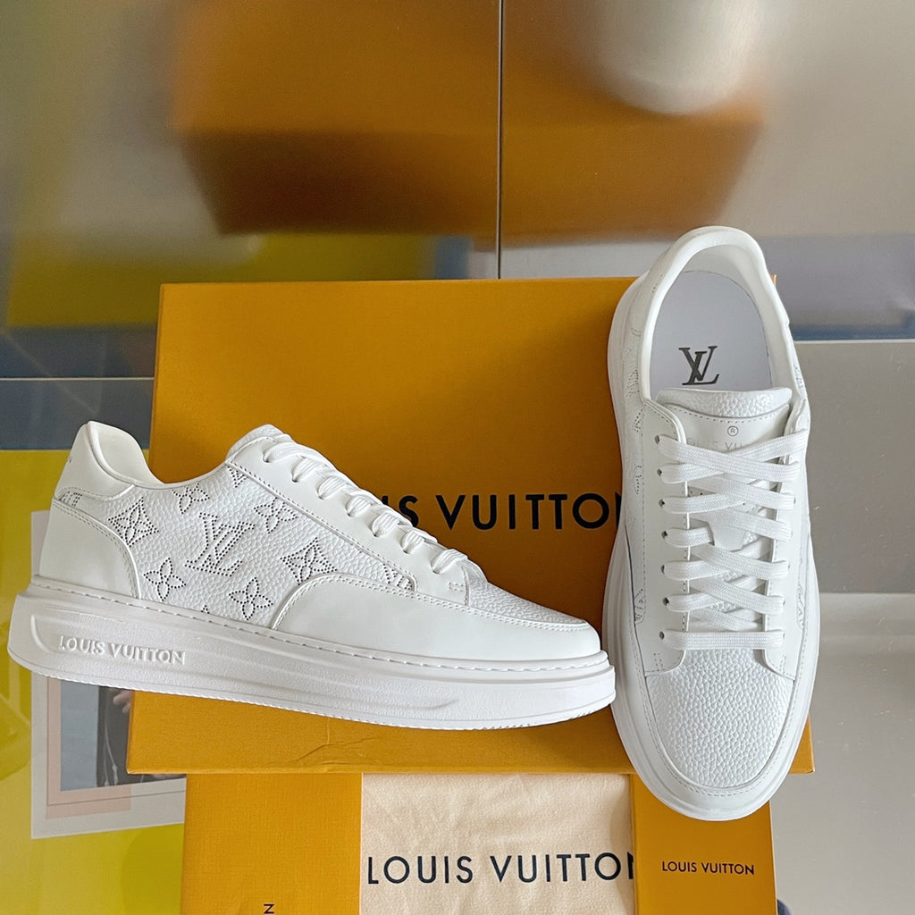 White lace-up low-top sneakers with monogram pattern and textured leather upper
