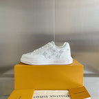 White lace-up low-top sneakers with monogram motif across the side panel