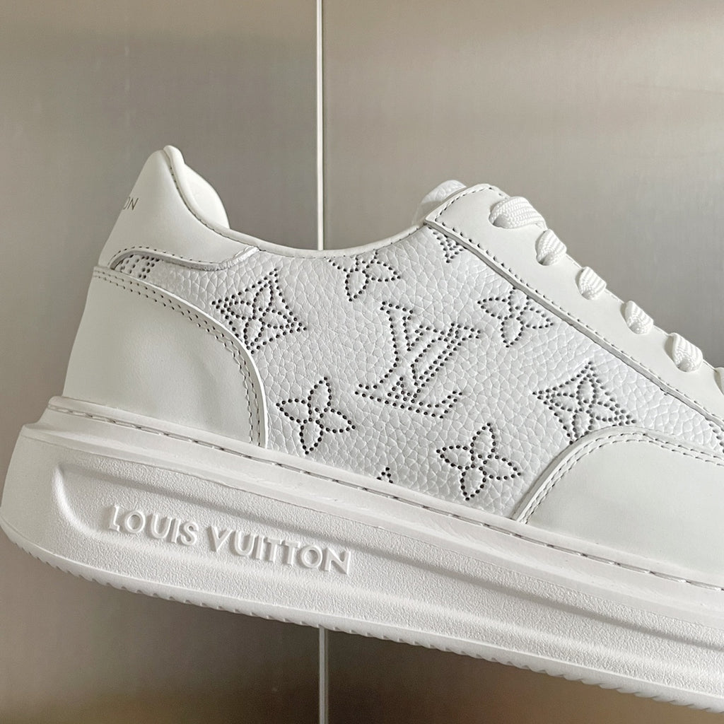 White sneaker upper with monogram floral and geometric pattern detail
