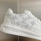 White sneaker upper with monogram floral and geometric pattern detail