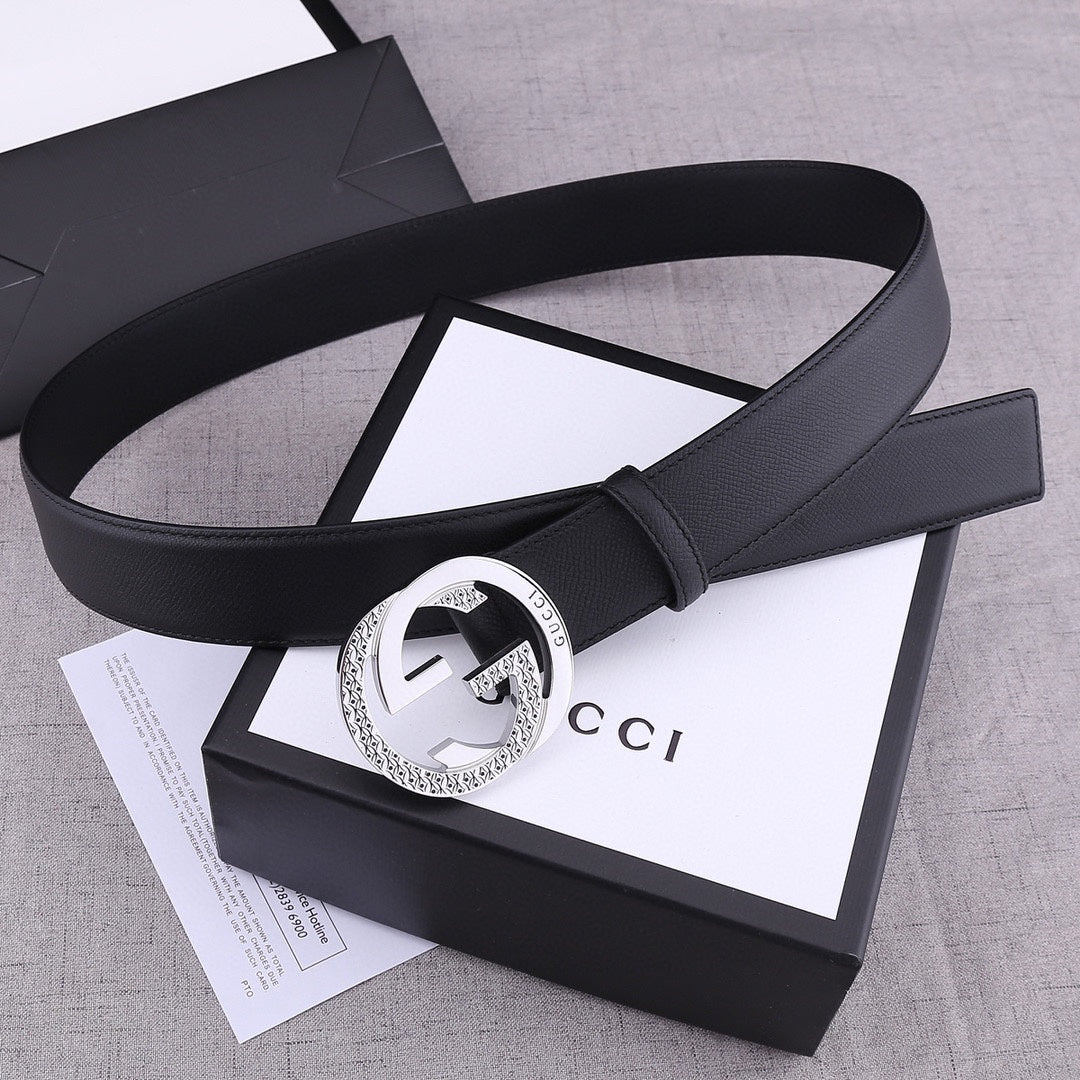 Black leather Gucci belt with silver-toned GG buckle and side strap view