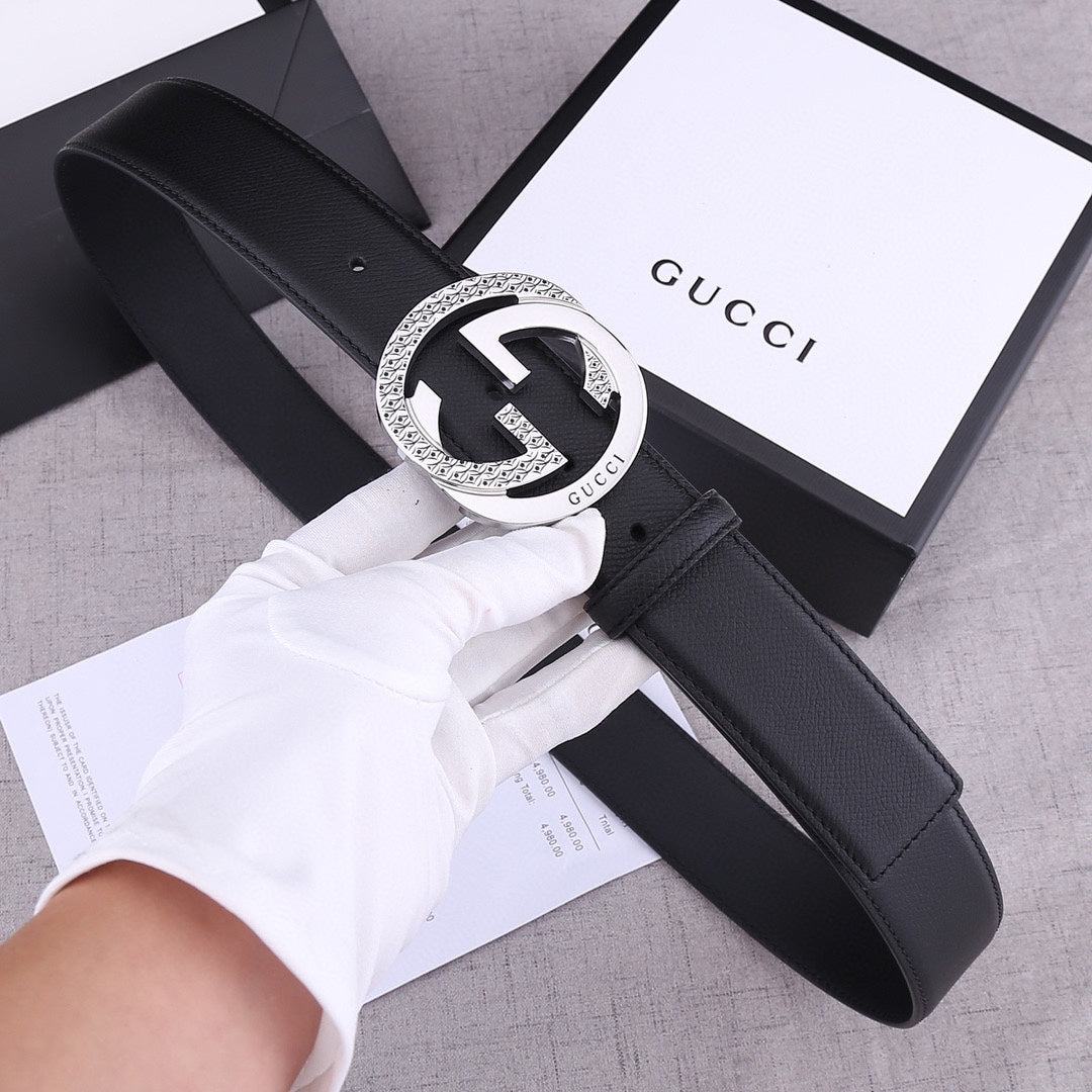 Black leather Gucci belt with silver-toned GG buckle, shown with box and papers