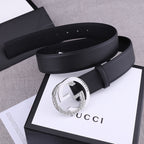 Black leather Gucci belt with silver-toned GG buckle, profile view