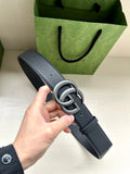 Dark blue leather belt with silver double-G buckle and pin closure.