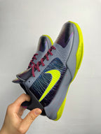 Basketball shoe shown from side: light gray upper with neon yellow sole and red laces