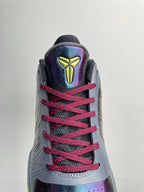 Basketball shoe back view with neon accents, gray upper, red laces, geometric heel logo