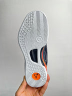 Basketball shoe outsole with white traction tread and dark heel insert