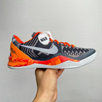Basketball shoes, dark navy with orange accents and white midsole