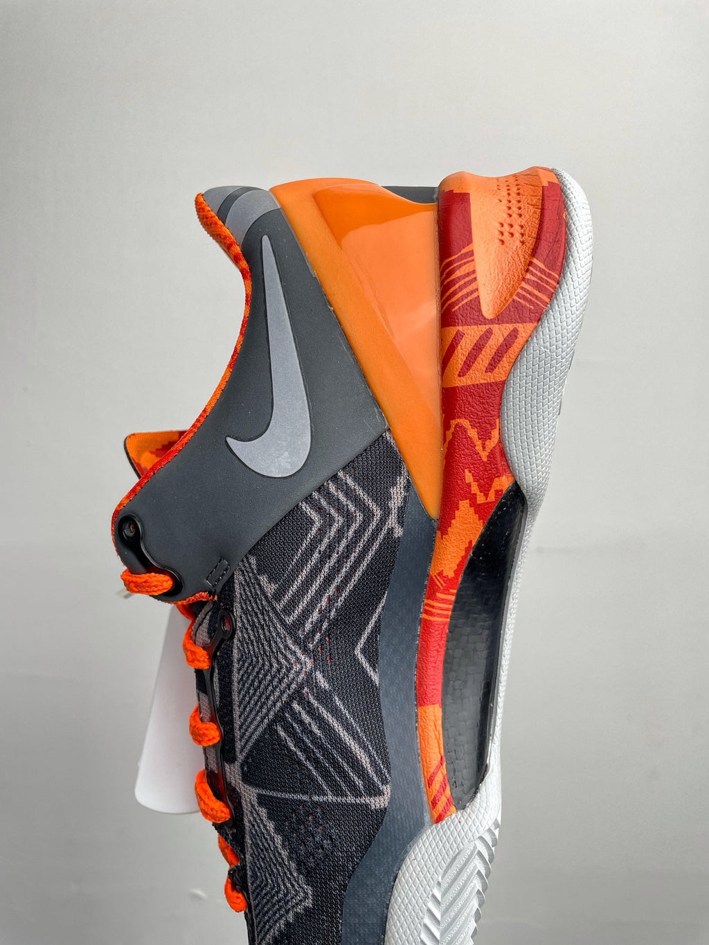Basketball shoes, dark navy with orange side panel and white cushioning