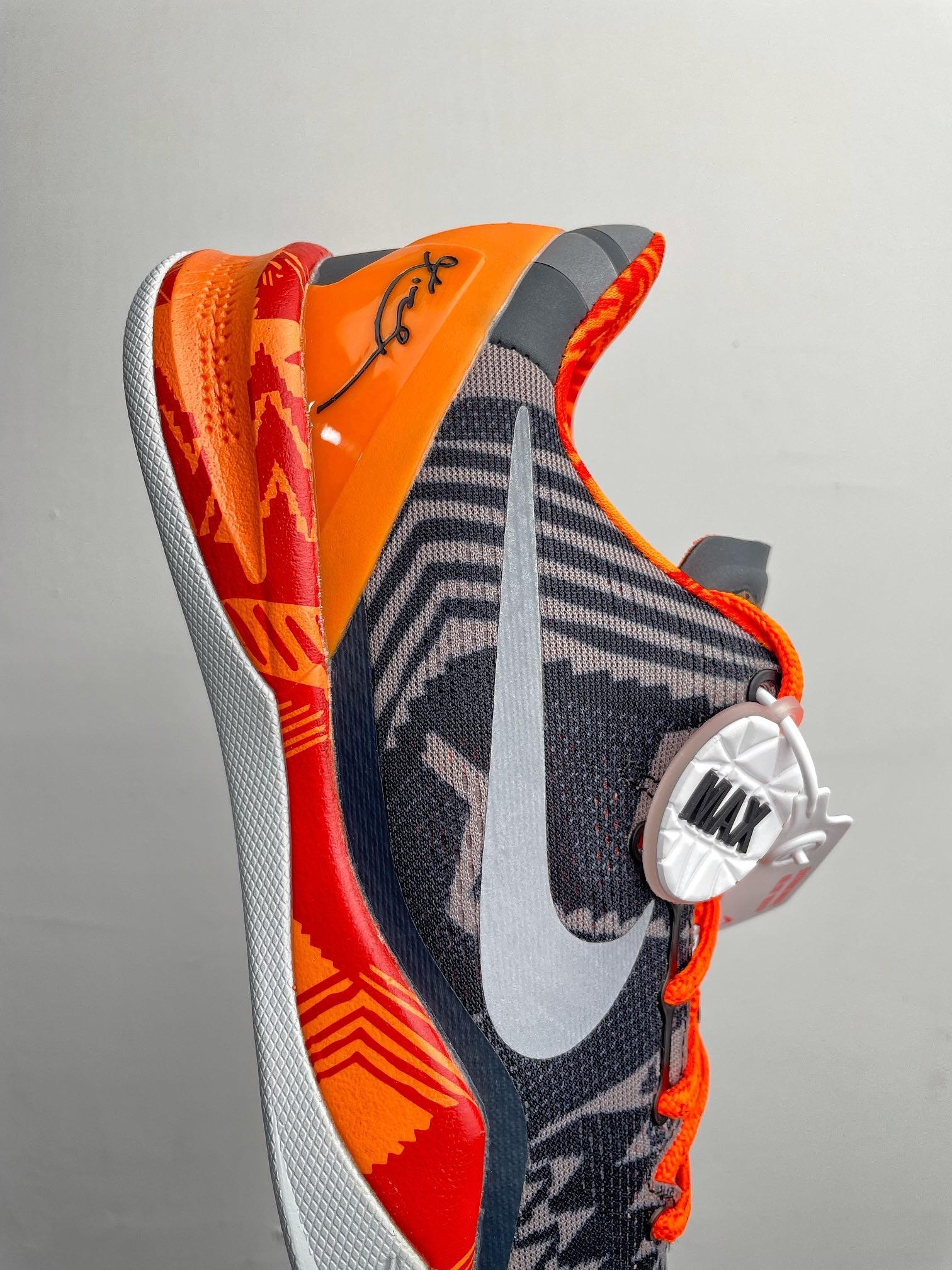 Basketball shoes, dark navy with orange heel, white foam sole