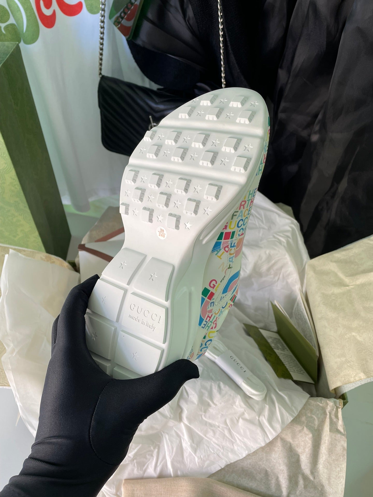 Gucci unisex sneakers, rear sole view with logo-print upper and treaded outsole