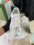 Gucci unisex sneakers, front view with white laces and logo-print upper