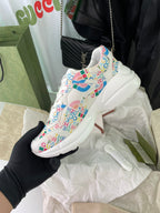 Gucci unisex sneakers, side view with multicolor logo print and white sole