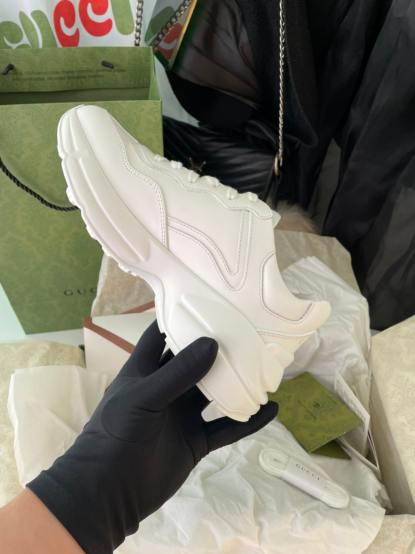 White Gucci sneakers, angled side view with padded collar