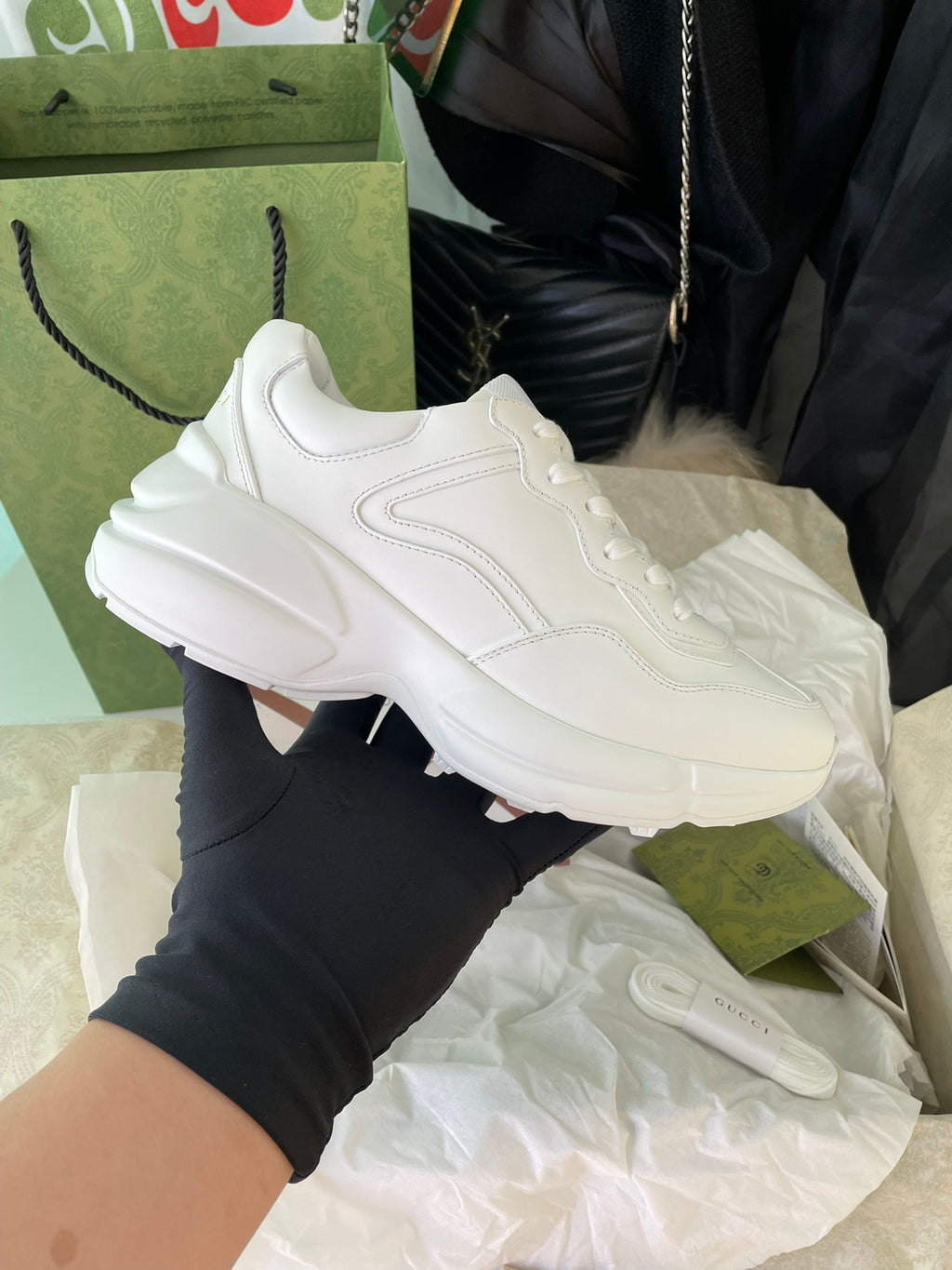 White Gucci low-top sneakers with layered sole and side stripe detail