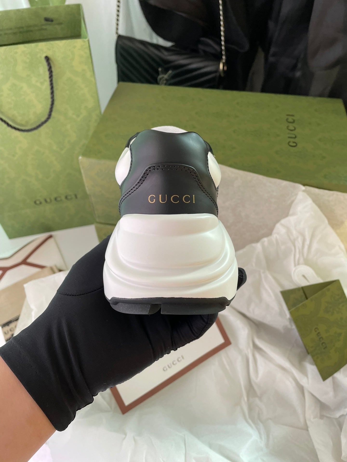 Gucci unisex sneakers, black and white, heel view with Gucci logo on back