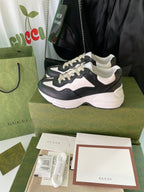 Gucci unisex sneakers, black and white, front view on shoebox and receipt card
