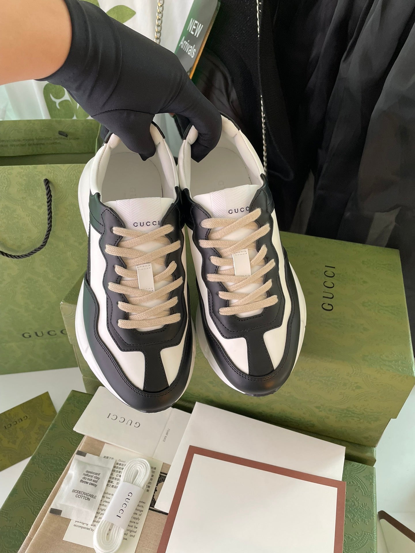 Gucci unisex sneakers, pair view, black and white with beige laces, lace-up style