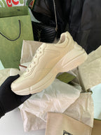 Beige lace-up Gucci sneakers with chunky sole, side profile