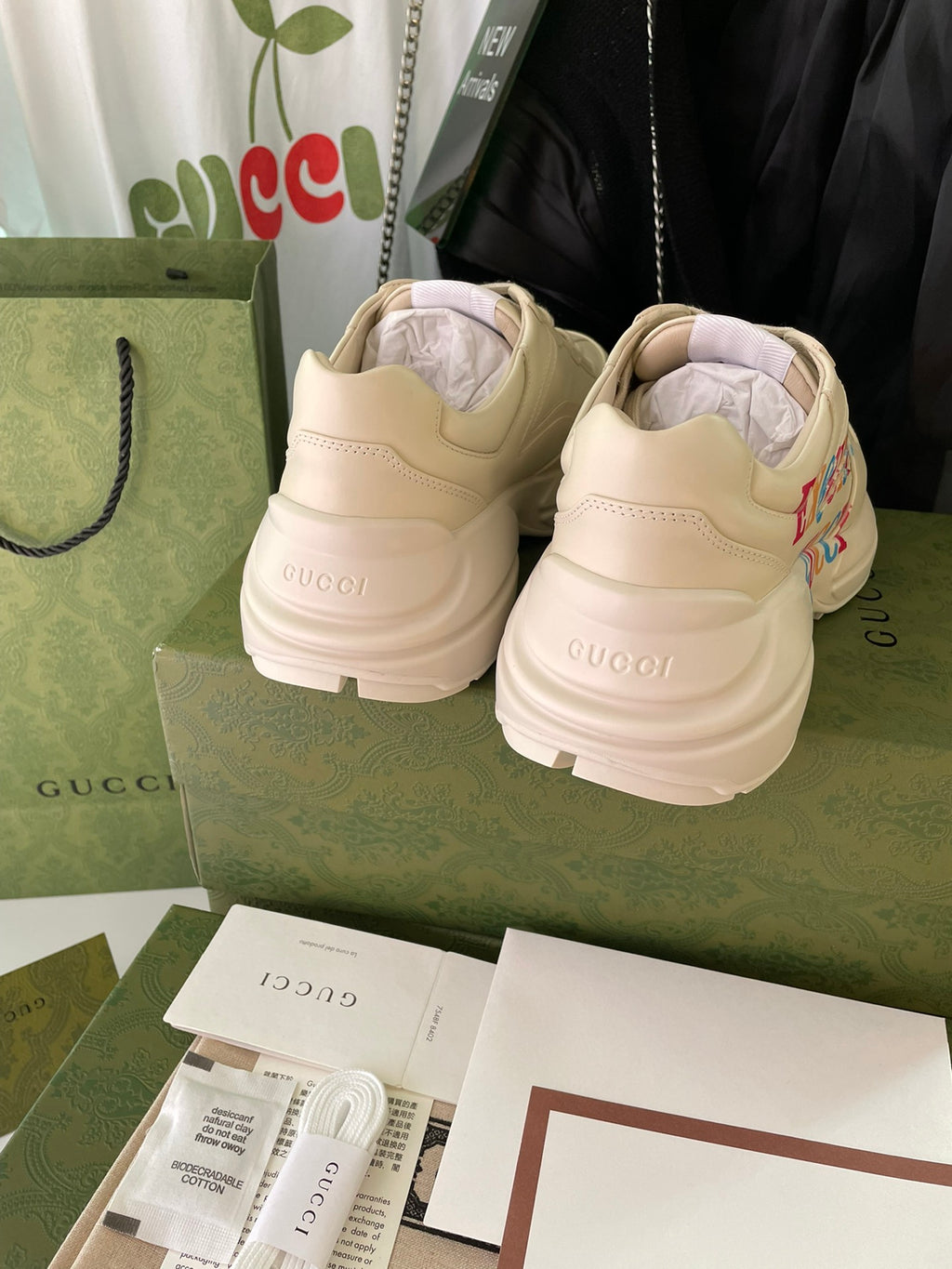Cream Gucci sneakers from back view with heel branding