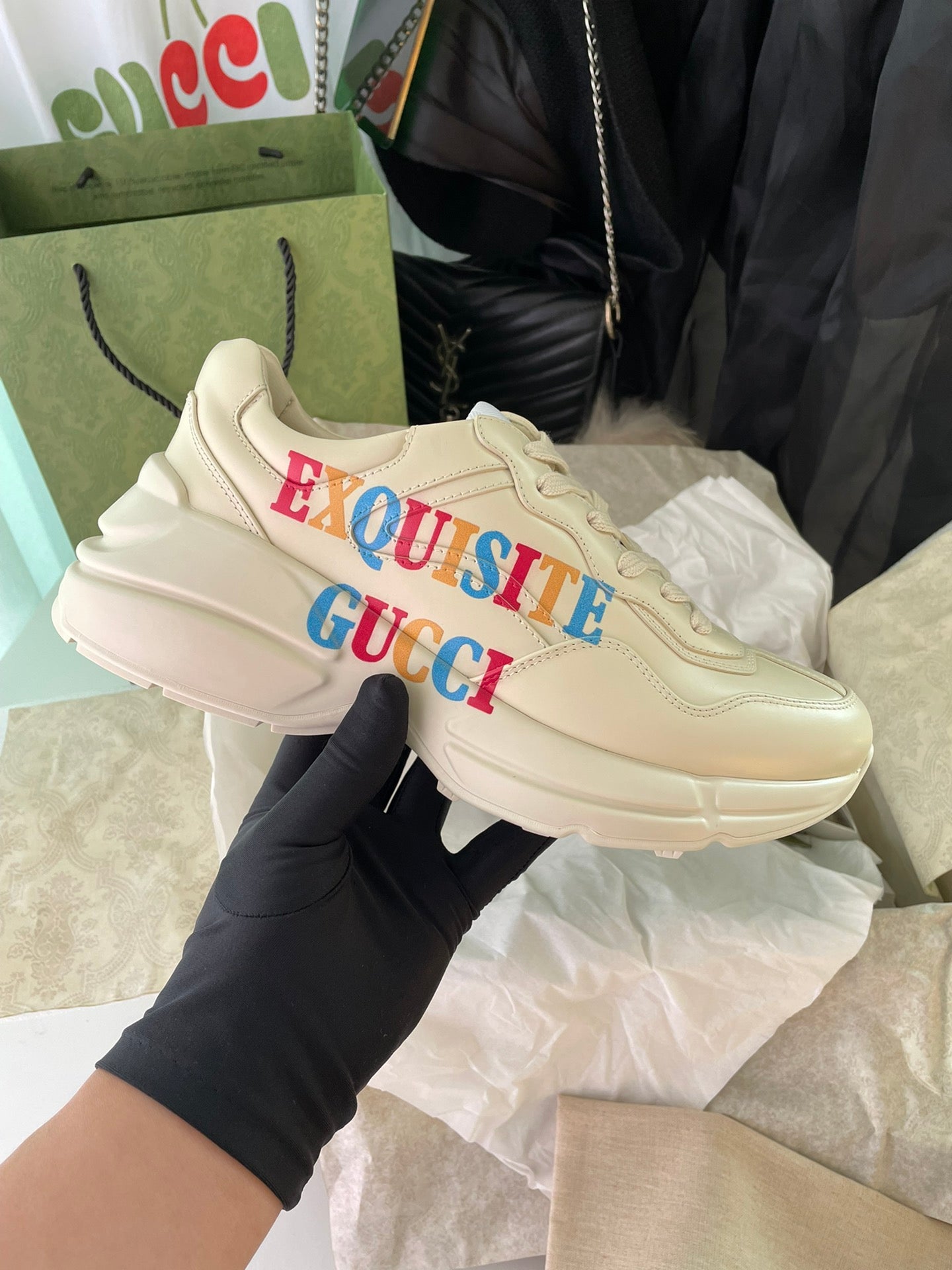 Cream Gucci sneakers with red and blue “EXQUISITE GUCCI” logo on side