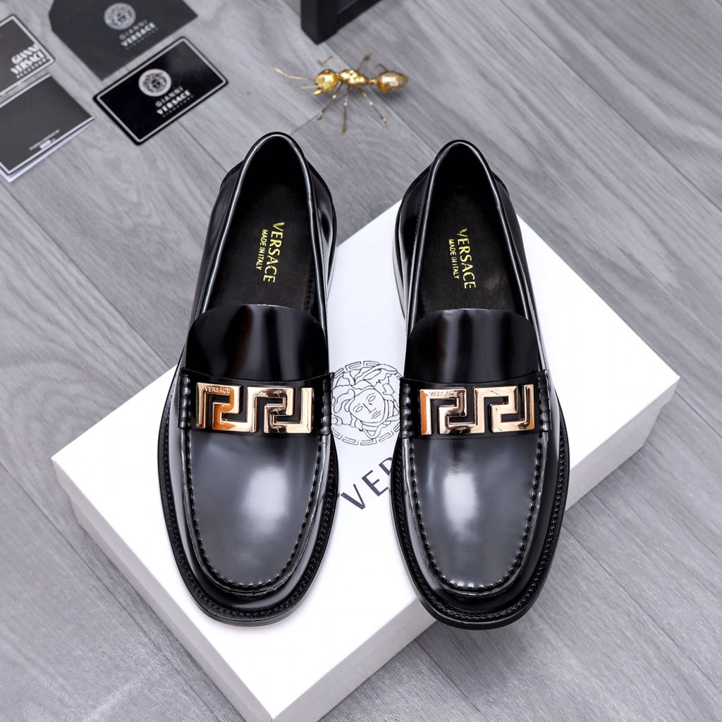 Luxury shoes Versace black leather loafers with gold Greca buckle detail