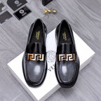 Luxury shoes Versace black leather loafers with gold Greca buckle detail
