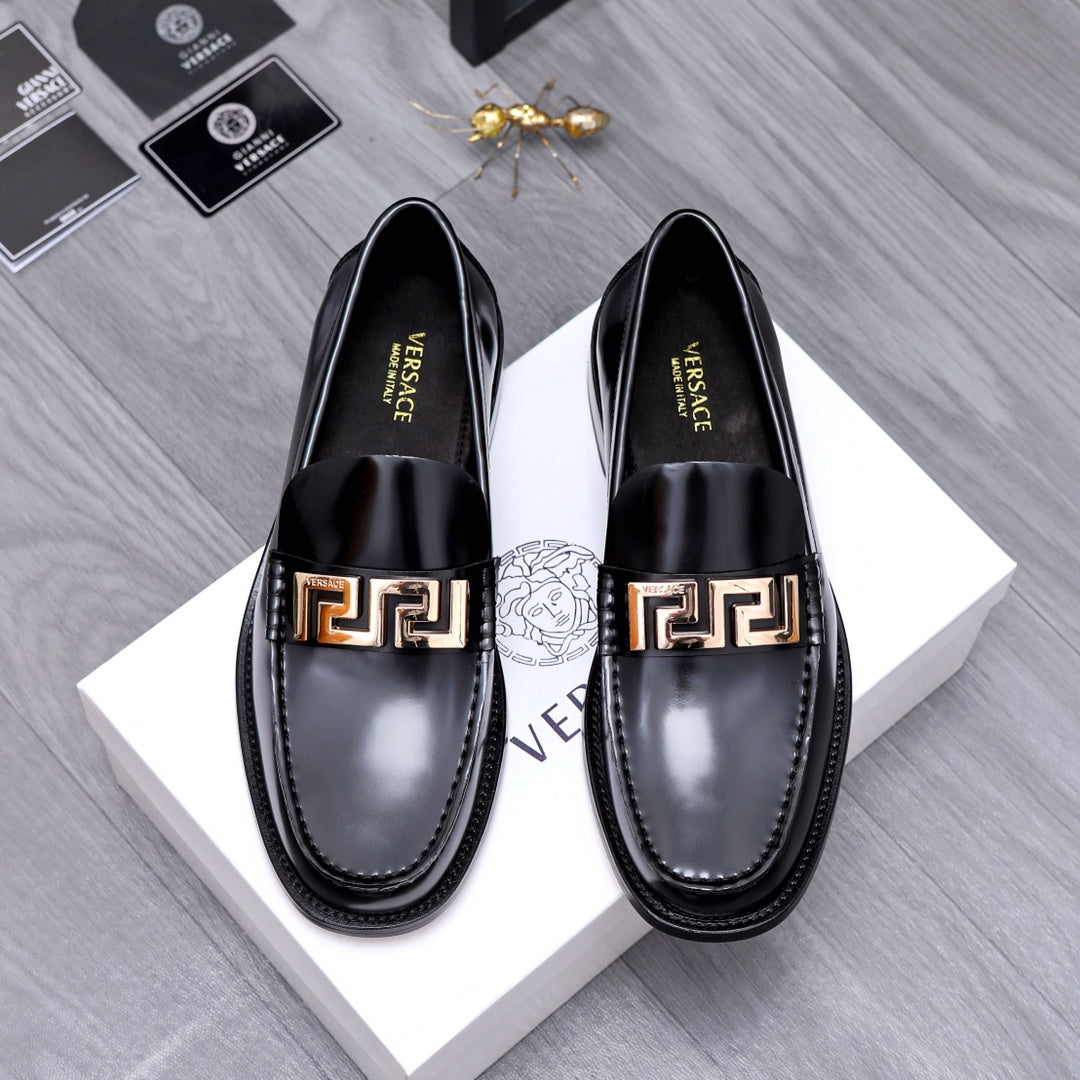 Luxury shoes Versace black leather loafers with gold Greca buckle detail