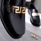 Luxury shoes Versace black loafer detail: gold Greca buckle and stitched edge
