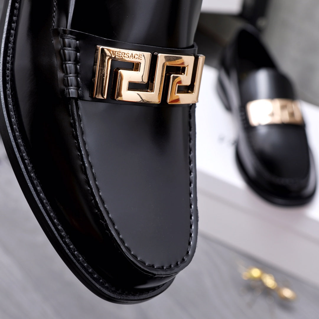 Luxury shoes Versace black loafer detail: gold Greca buckle and stitched edge