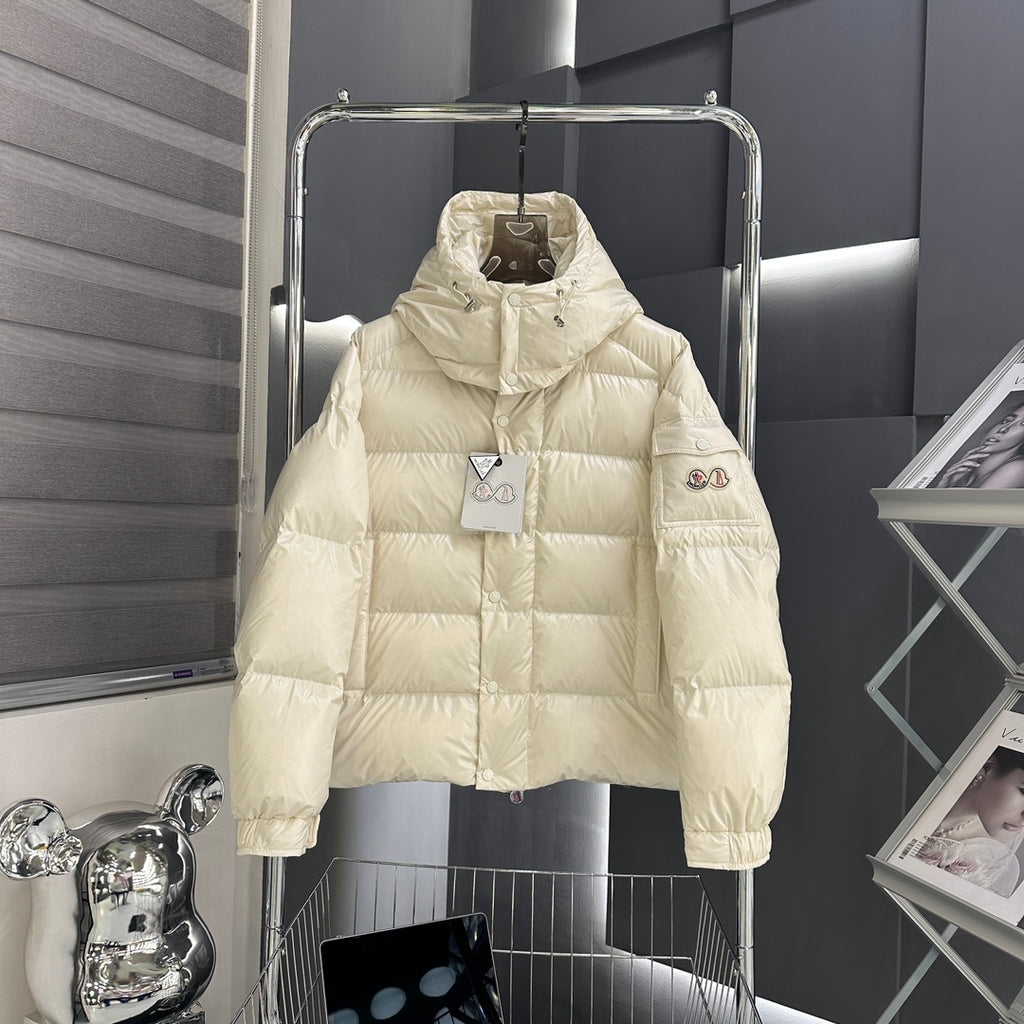 Moncler long puffer jacket in light cream, hooded, full-zip front with button placket